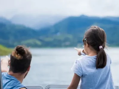 A father and daughter enjoying quality time by Arenal Lake, Costa Rica.