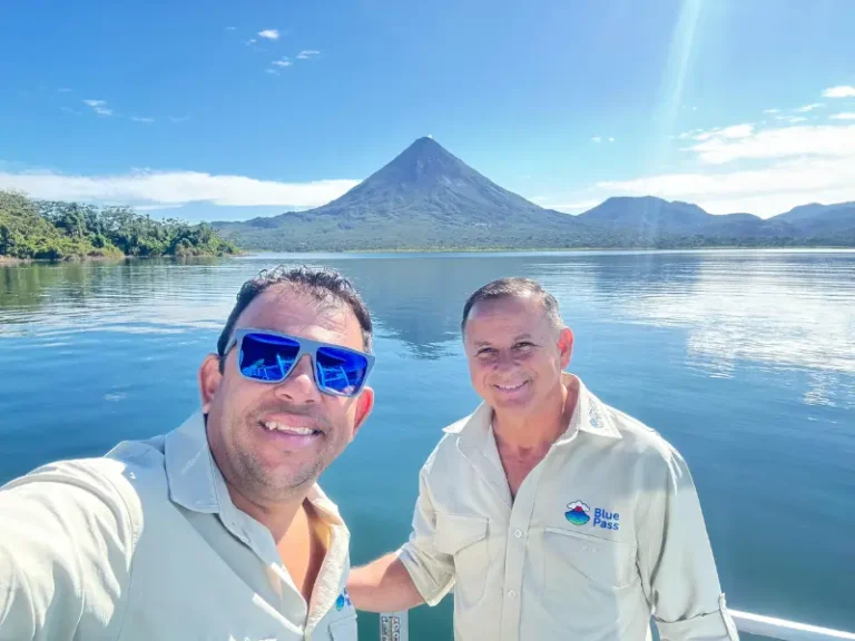 Local Tour guides smiling, Blue Pass celebrating their regenerative tourism journey on Lake Arenal—where it all began.