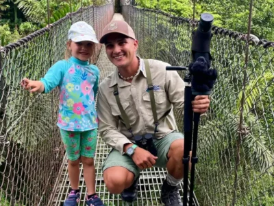 A birdwatchig session led by Blue Pass, teaching children to connect with biodiversity through the lens near Lake Arenal.