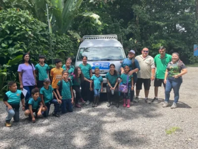 Blue Pass team taking school student to a nature tour, demonstrating how tourism can directly support education and development.