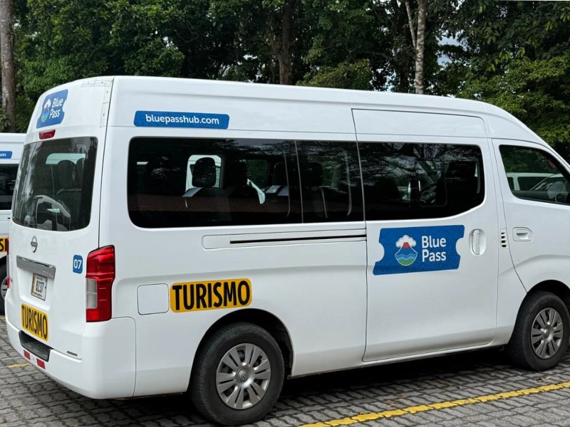 Blue Pass tourist van parked in La Fortuna, Costa Rica